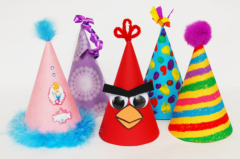 Cone Shaped Birthday Party Hat with Stripes and Ribbons Stock